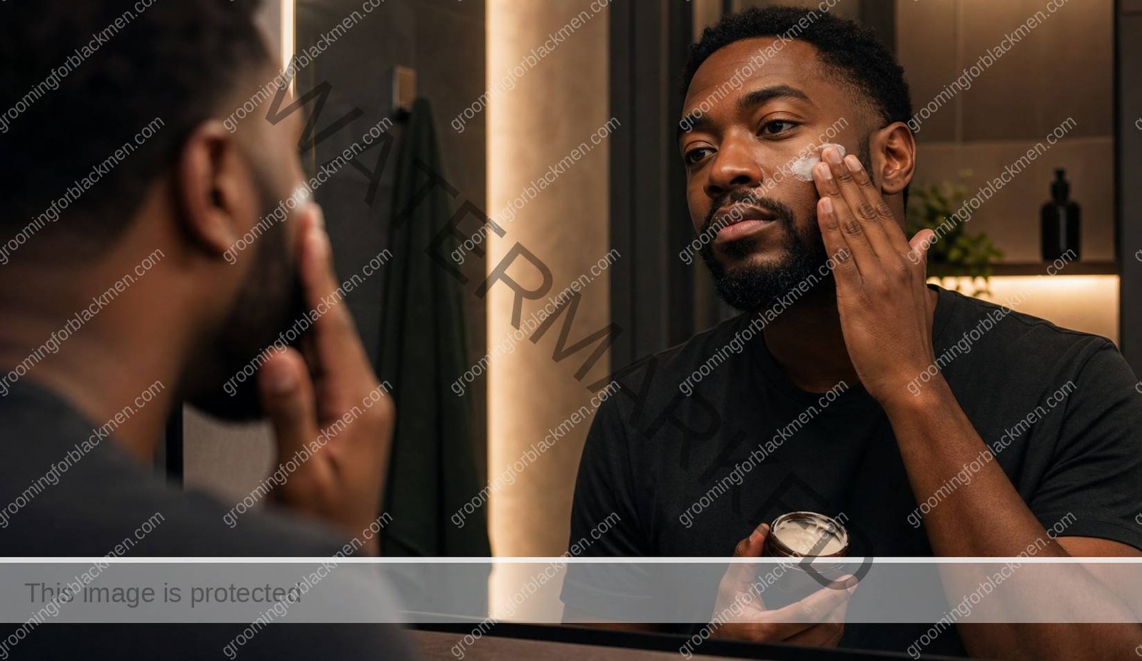 Black man applying moisturizer during a nighttime skincare routine - Grooming For Black Men