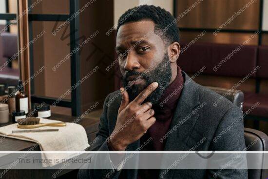Black man grooming routine image for Beard Product Buildup for Black Men: Practical Grooming Guide