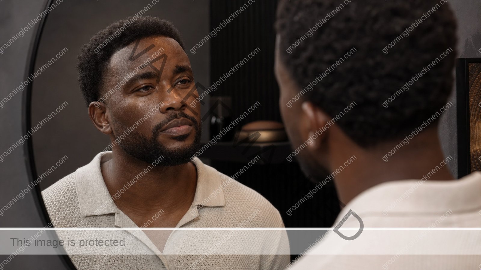 Black man beginning a face looks ashy after moisturizer Black men routine in a premium grooming setting