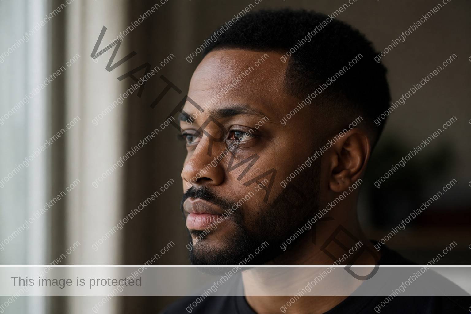 Black man assessing eye cream for Black men dark circles with natural rich brown skin texture visible