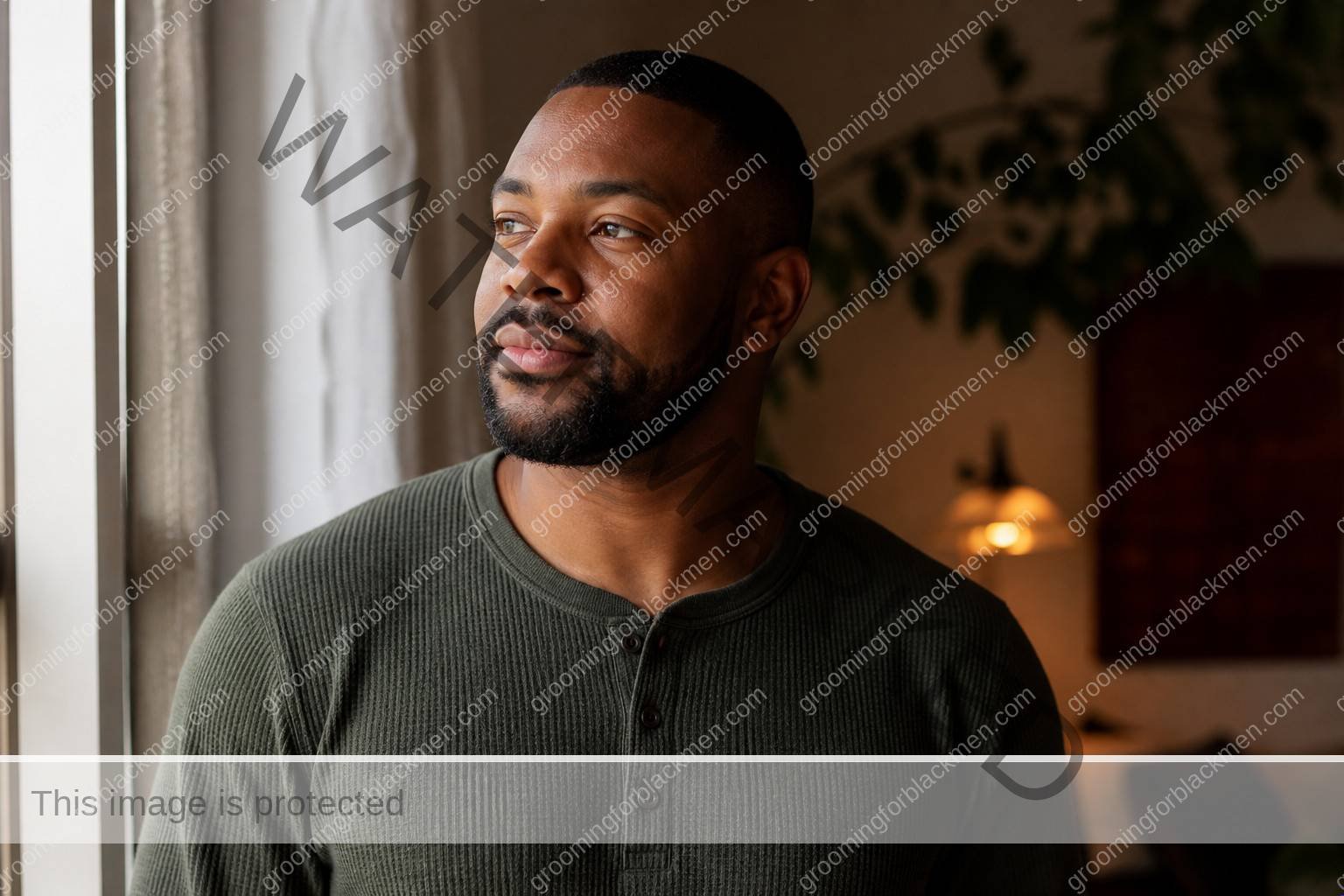 Black man completing a calm routine for eye cream for Black men dark circles with realistic skin texture