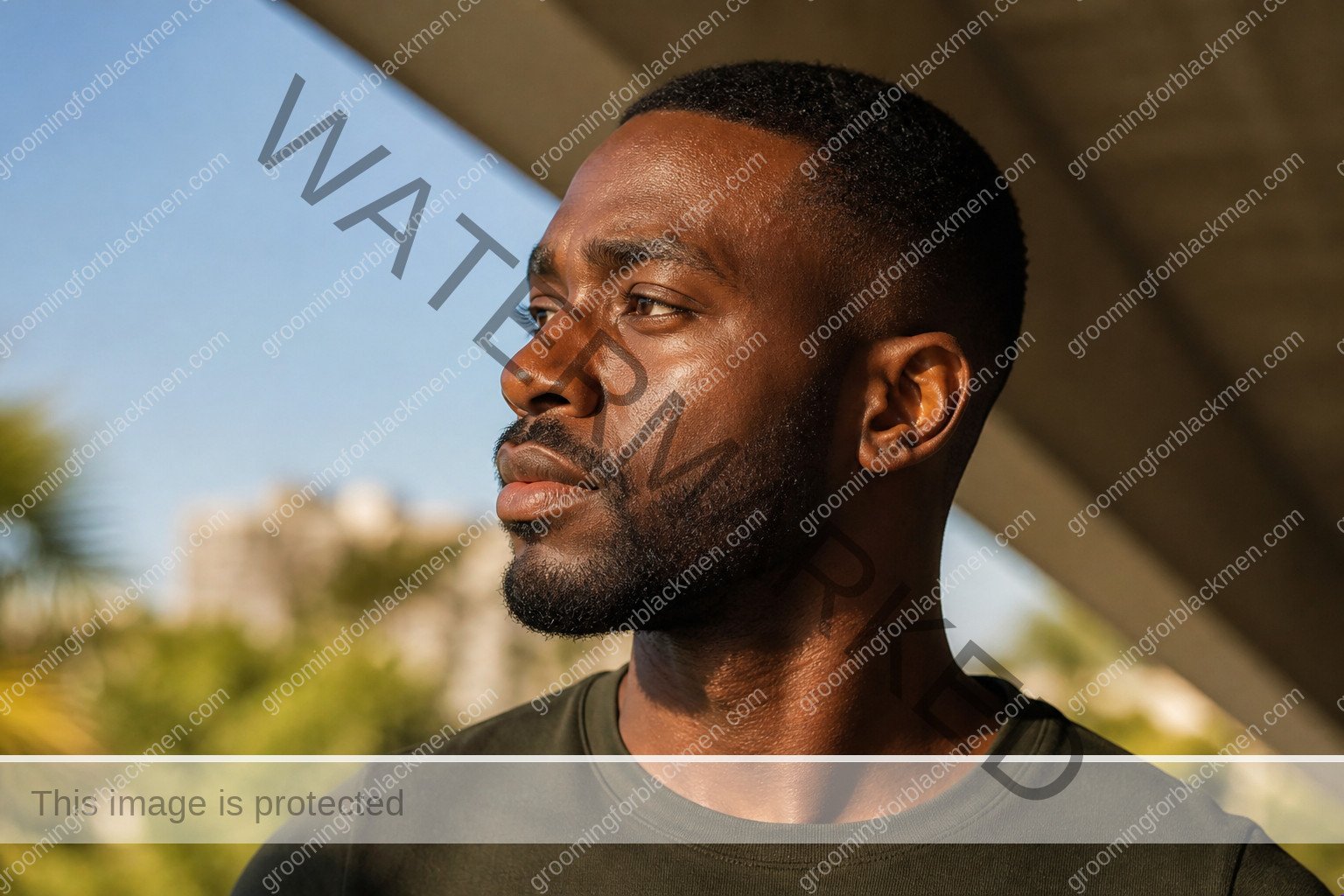 Black man assessing sunscreen for Black men why necessary with natural rich brown skin texture visible